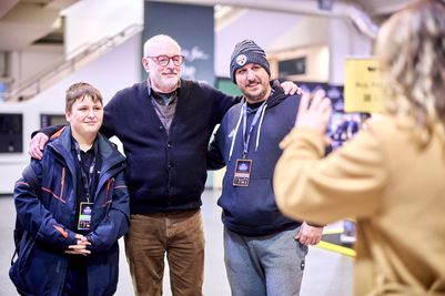 Voice of Meowth in Pokemon, Matthew Sussman at the London Card Show with fans.jpg