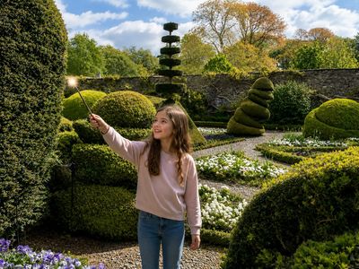 Child in the Levens Hall gardens