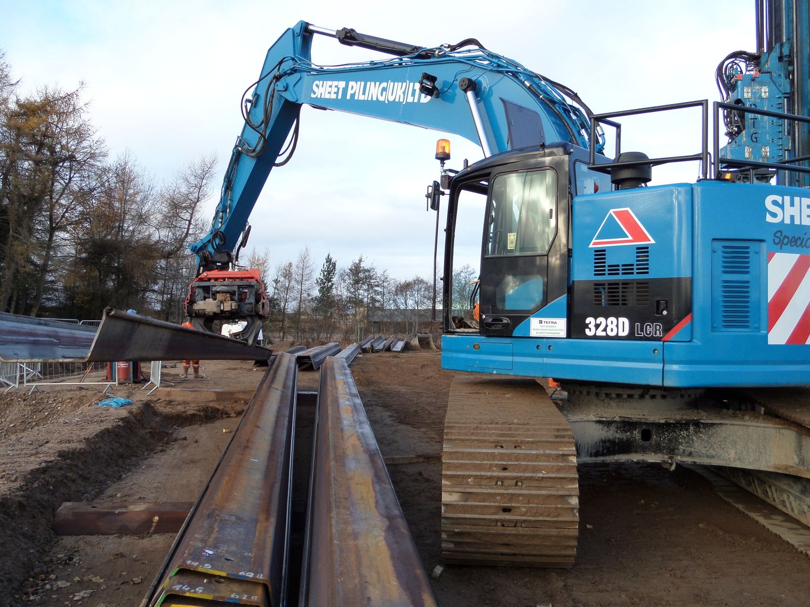 Infrastructure widening equipment in operation by Sheet Piling (UK) Ltd crew