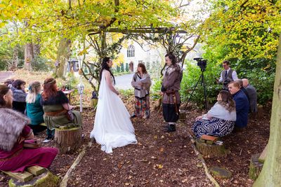 Couple having Viking themed woodland wedding at Langley Castle, Northumberland
