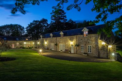 Castle View accommodation at Langley Castle Hotel, Northumberland, by night.