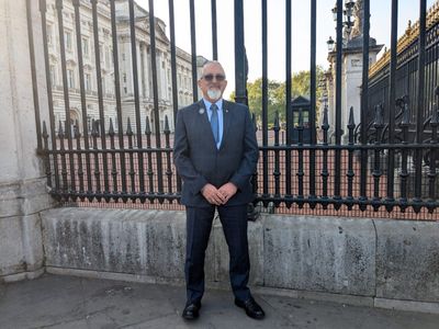 Bryan Baird outside of Buckingham Palace