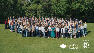 The Gardner Leader team together attending its annual staff conference (with logos)
