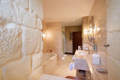 Contemporary bathroom within the medieval walls of Langley Castle Hotel.