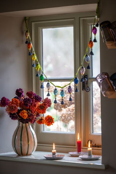 Assorted coloured baubles with grey tassels on green ribbon 2.jpg