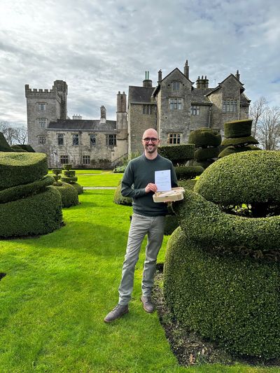 Levens Hall and Gardens owner, Richard Bagot, with the Topiary Message in a Bottle