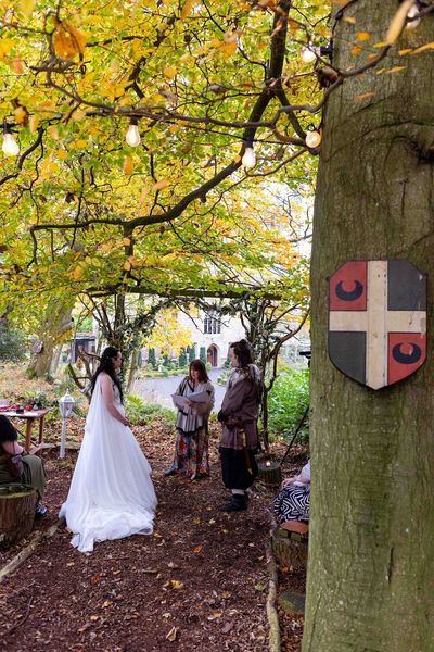 Couple having Viking-themed woodland wedding at Langley Castle, Northumberland
