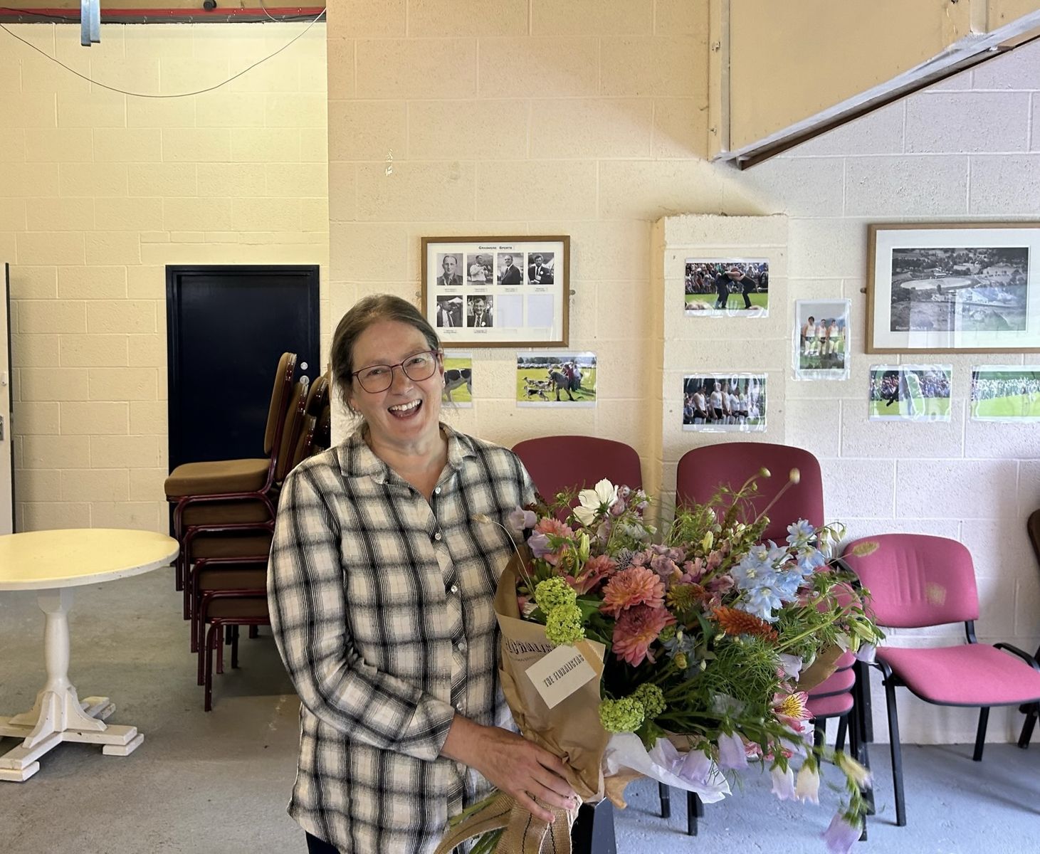 Deborah Black, the retiring Sports and Field Manager of Grasmere Lakeland Sports and Show, with her bouquet of flowers.