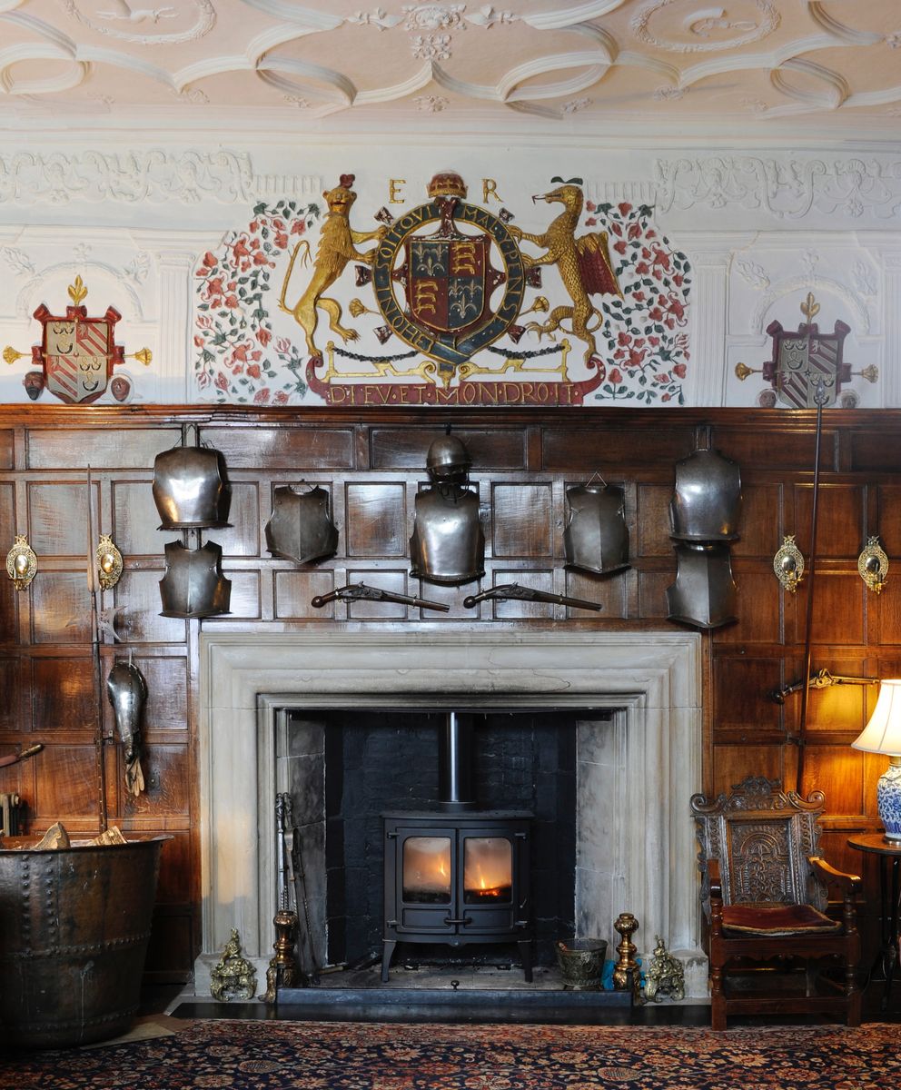The overmantel and fireplace in the Great Hall at Levens Hall and Gardens, Cumbria, UK.