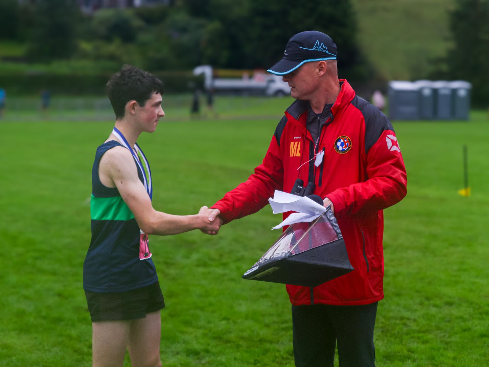 Zeke Sumner being presented with the Pete Bland bursary by Pete's son, Matt Bland