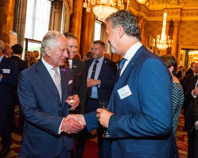 The King congratulates Gary Stevens at Buckingham Palace Reception