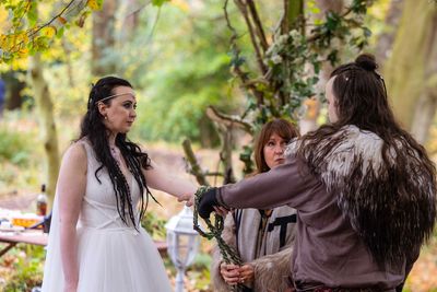 Couple having Viking-themed woodland wedding at Langley Castle, Northumberland