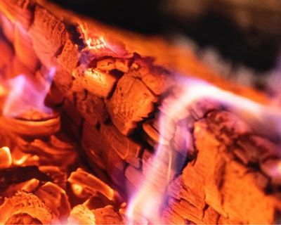 Smouldering wood on fire place