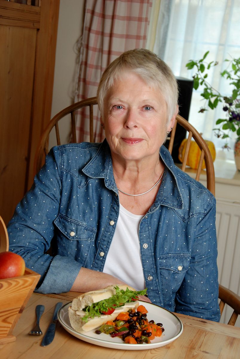 Woman seated with a salad baguette lunch