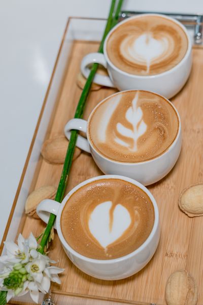 This is a photo of three coffees on a tray taken at Cafe Kutubna. 