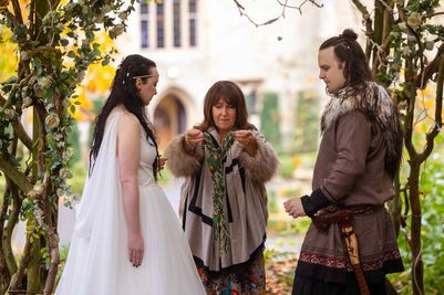 Bride and groom, Benjamin and Annmarie Coomber, prepare for handfasting ceremony 