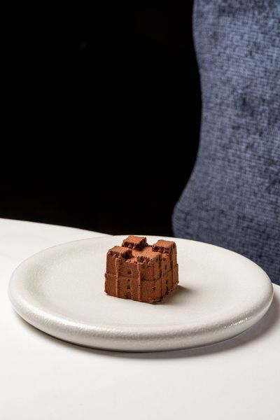 The Dark Chocolate Castle dessert, created as a replica of medieval Langley Castle Hotel, Northumberland, UK, in chocolate mousse, prior to being topped.