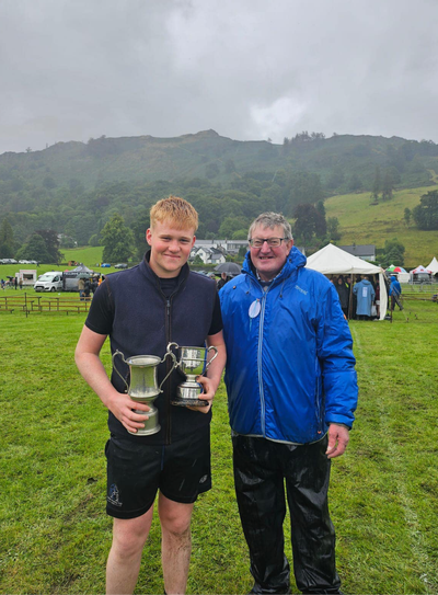 George Peacock, winning Cumberland and Westmorland wrestling trophies at Grasmere Lakeland Sports and Show