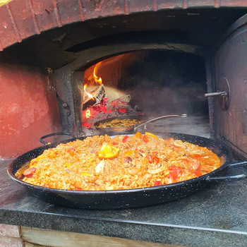 Paella cooked in a wood-fired oven from Valoriani, by the Orchard Ovens team