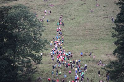 Runners heading up the fell at the start of a fell race at Grasmere Lakeland Sports and Show