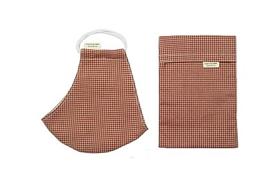 Terracotta coloured Gingham face mask from Cocorose London made in breathable cotton and with matching pouch.  