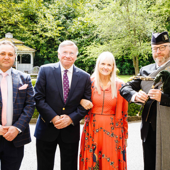 Celebrating 40 years of Langley Castle as a hotel and restaurant L to R: Mohamed Serag (general manager), the Baron and Baroness of Langley (Dr Stuart and Dr Mariann Madnick) and Northumbrian piper, Paul Martin.