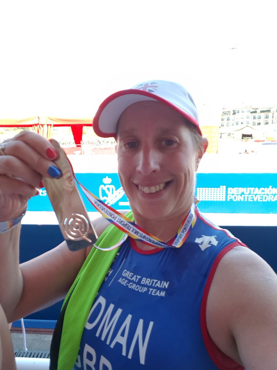 Tasha Redman with medal.jpg