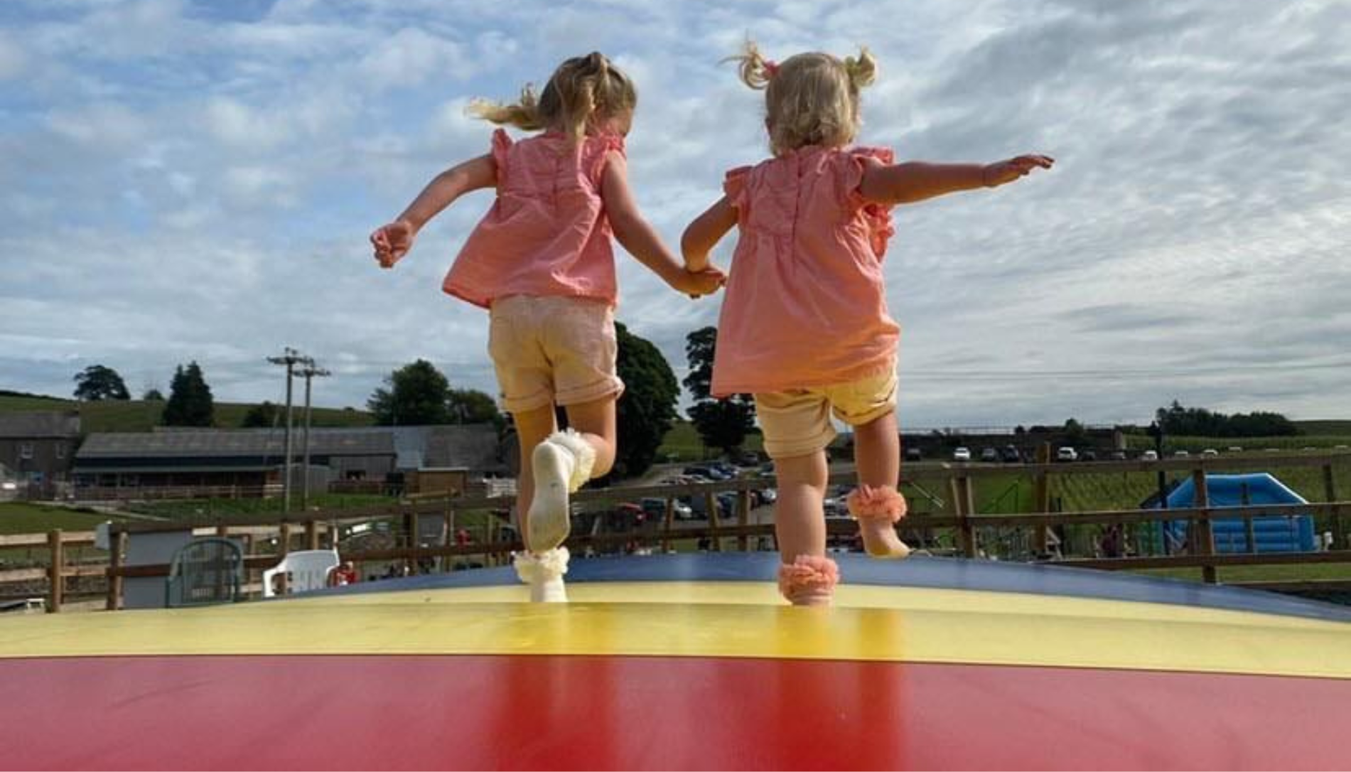 Children on giant air pillow bouncers at the Lakeland Maze Farm Park near Kendal, Cumbria