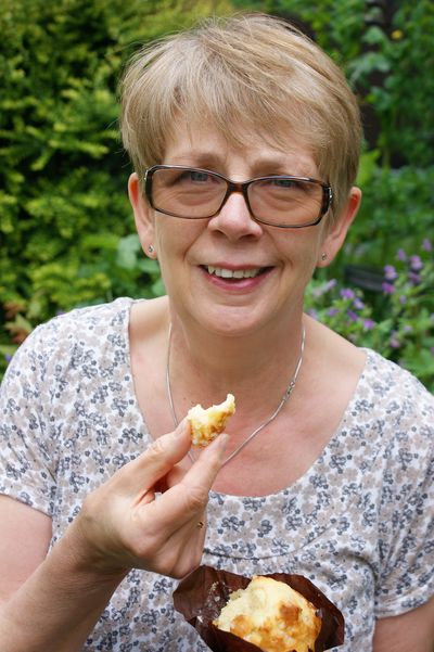 Woman eating a vegetarian muffin