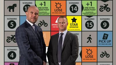 Paul Coates and Ian McCarron in front of the broker's new Road Hierarchy board game