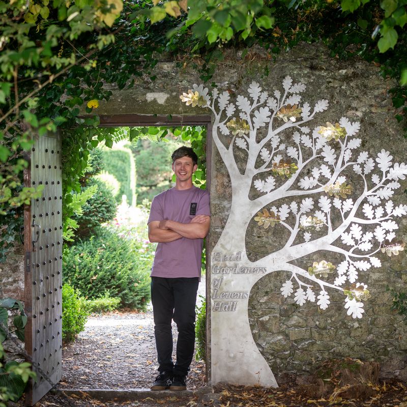 Tom Vickers the designer and creator of the head gardeners' commemorative tree sculpture at Levens Hall and Gardens, Lake District, UK