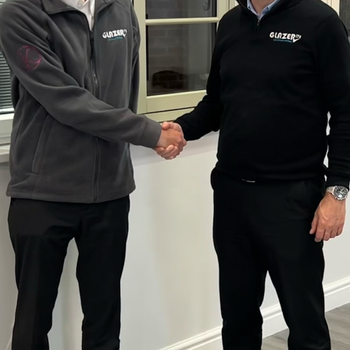 Jordan Davidson (L) is welcomed by Glazerite's Jeff Dunn.jpg