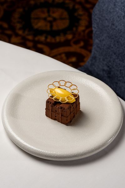 The complete Dark Chocolate Castle dessert, created as a replica of medieval Langley Castle Hotel, Northumberland, UK, in chocolate mousse.  The creation of Langley Castle's Culinary Director, Mark Greenaway.
