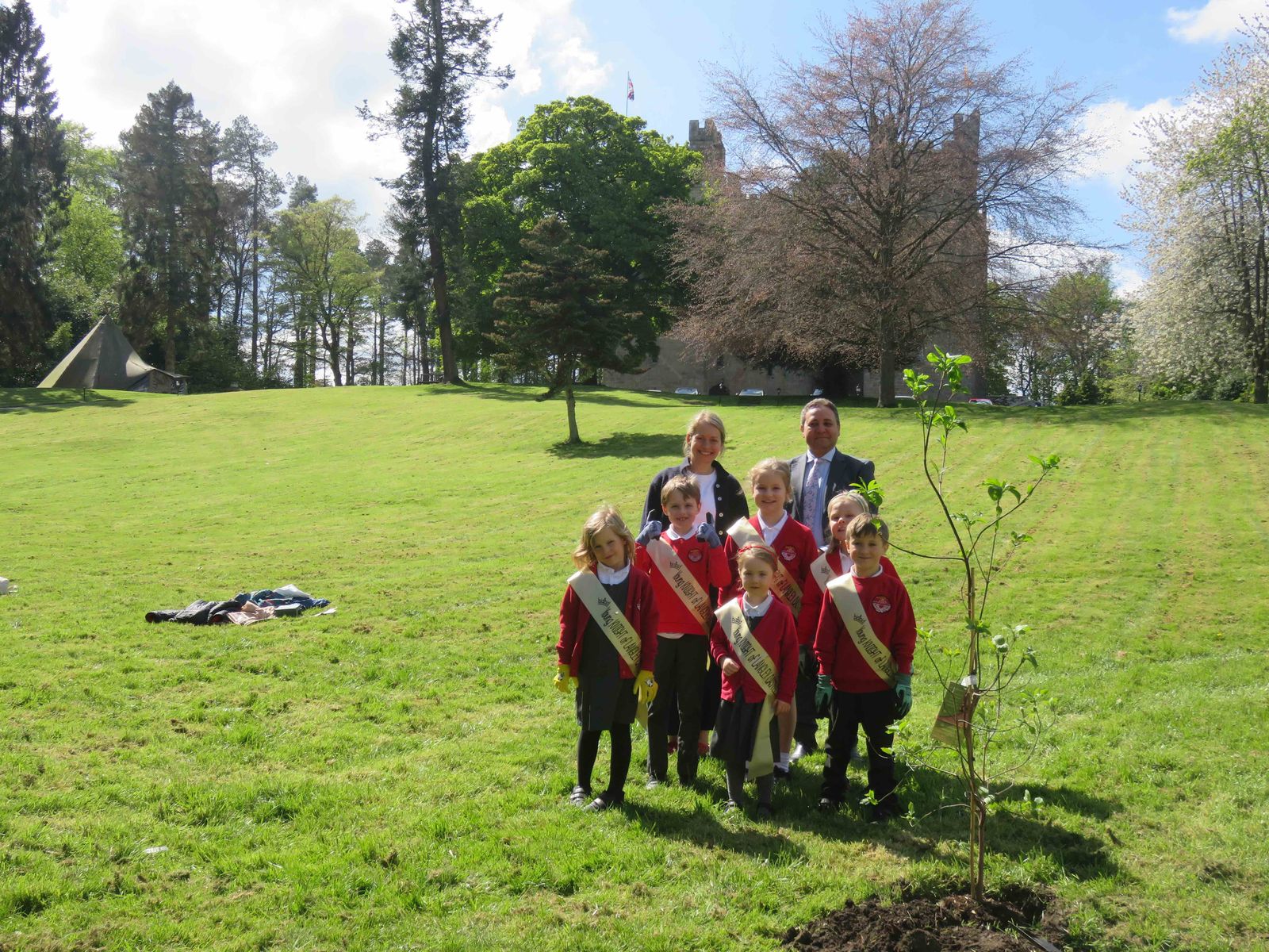Pupils and teacher, with Langley Castle General Manager, Mohamed Serag, at the tree planting location below Langley Castle Hotel.