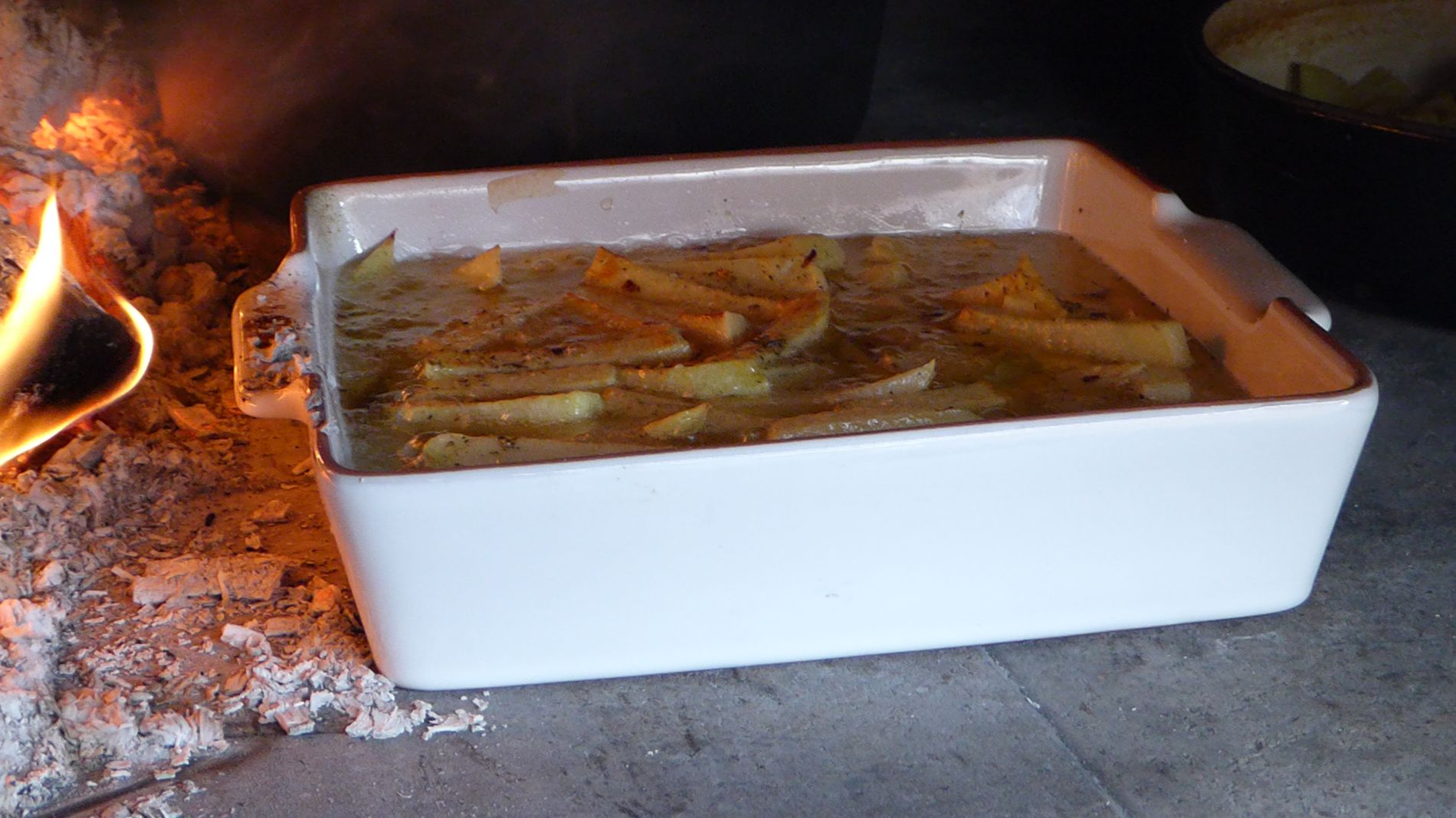 Chips cooking in a Valoriani woodfired oven from Orchard Ovens