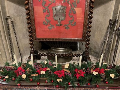 Christmas decor in a fireplace at Levens Hall and Gardens, Cumbria.