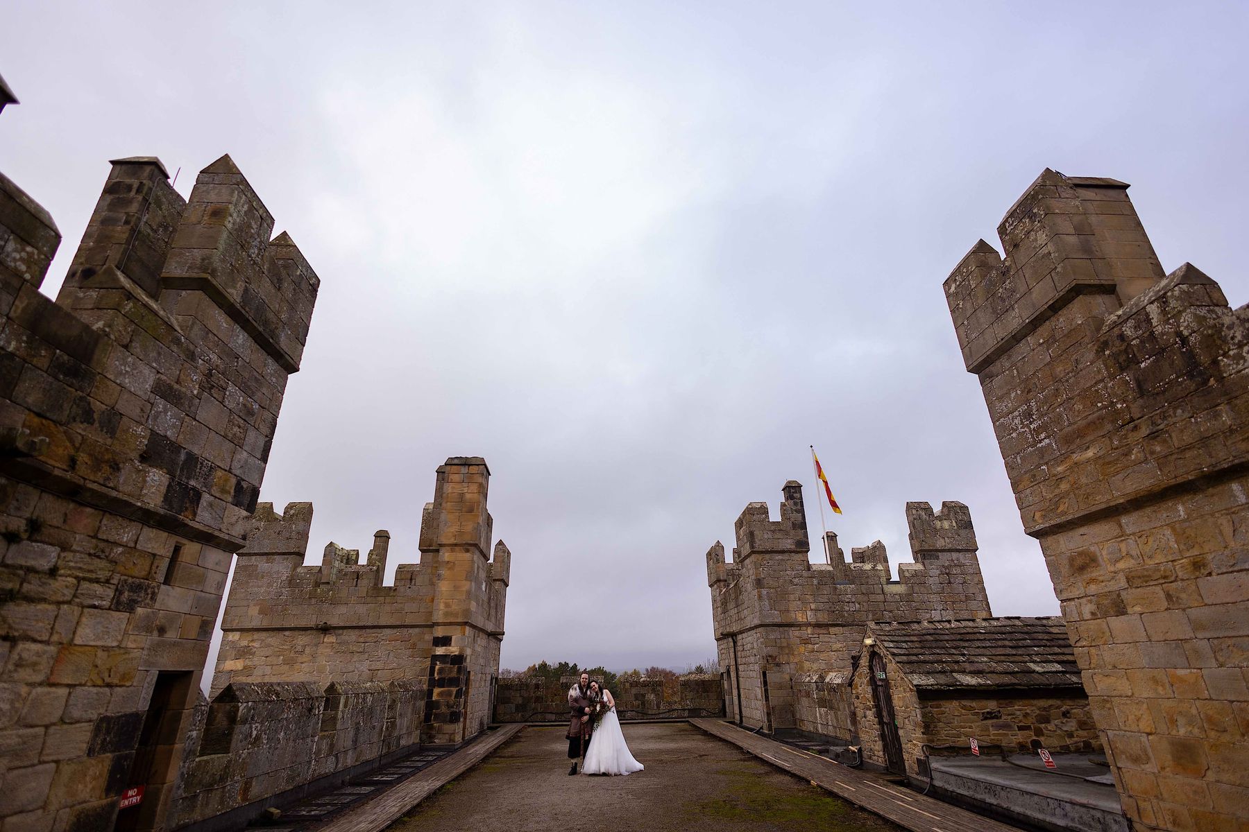 Benjamin and Annmarie Coomber, on the battlements of medieval Langley Castle, Northumberland, on the day of their Viking wedding