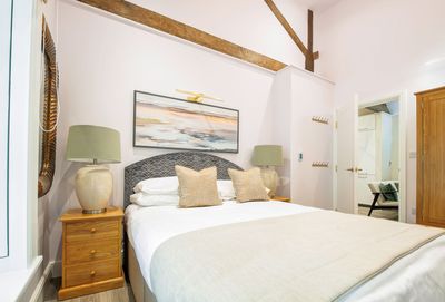 One of the bedrooms at Toll Bar Luxury Villa at Langley Castle, which comes with an en suite bathroom.