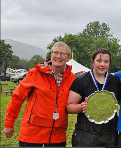 Linda Scott, Vice President of both the Lakeland Dialect Society and the Cumberland and Westmorland Wrestling Association, with Rosie Hodgson, one of 2024's wrestling champions at Grasmere Lakeland Sports and Show.