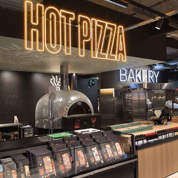 A commercial wood fired Valoriani pizza oven, supplied by Orchard Ovens, in a fast food retail environment/takeaway operation.