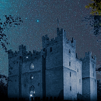 Langley Castle in dark sky, starry night setting