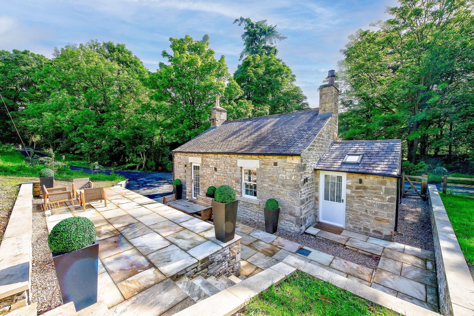 Exterior and private, secluded terrace of Toll Bar Luxury Villa at Langley Castle, Northumberland, UK