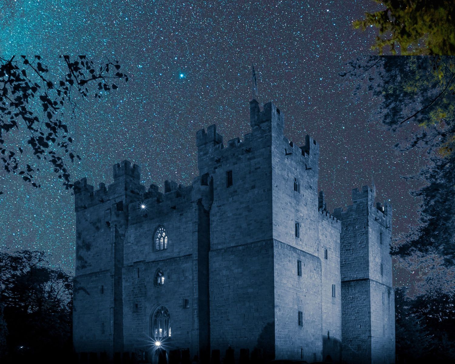 Langley Castle in dark sky, starry night setting