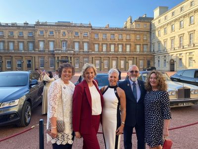 Pat Dyminski, Tina Seymour, Jayne Foster, Bryan Baird, Emma Bowles outside Buckingham Palace