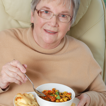 Woman eating a vegetarian meal