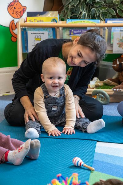 Hopscotch children, parents and staff take part in yoga.jpg