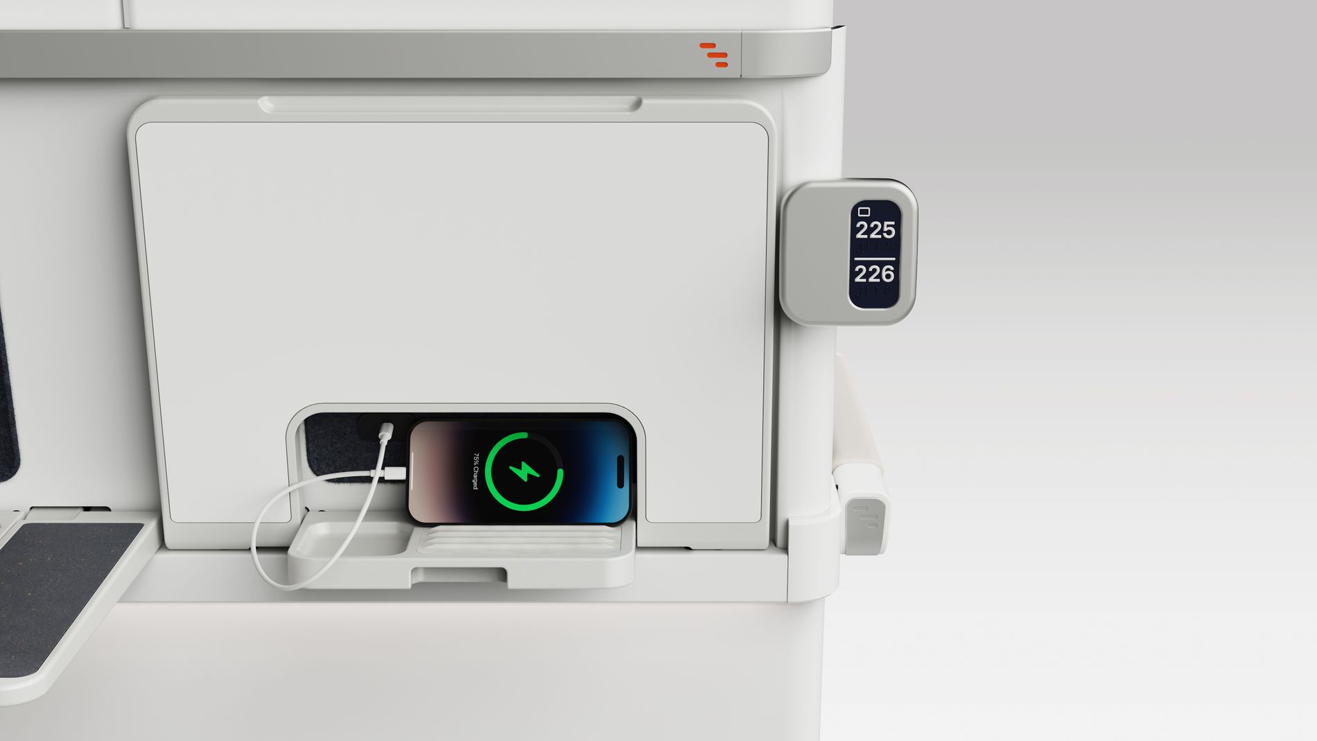 Rear view of ALIZÉ seat showing mobile phone charger outlet and phone storage space