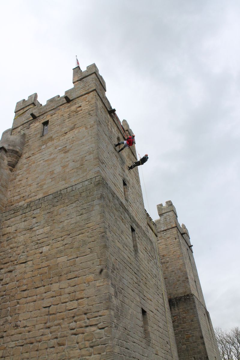 Bold knights scale Langley Castle's walls,