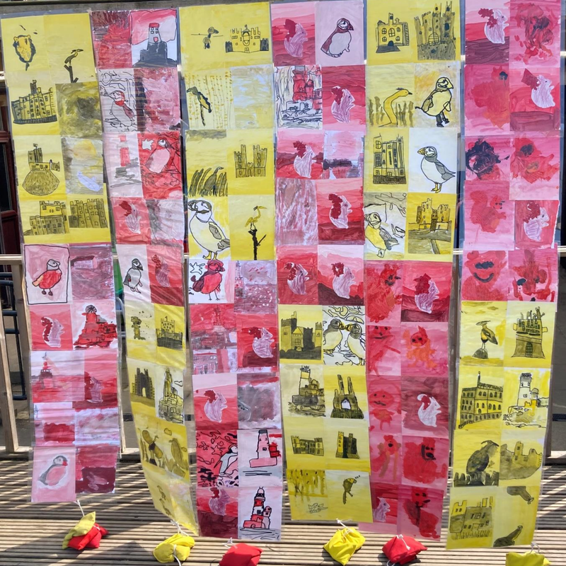 The special flag created by Stannington First School pupils for Northumberland Day 2023, featuring their own artwork.