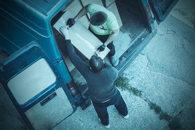 Thieves unload goods from a van